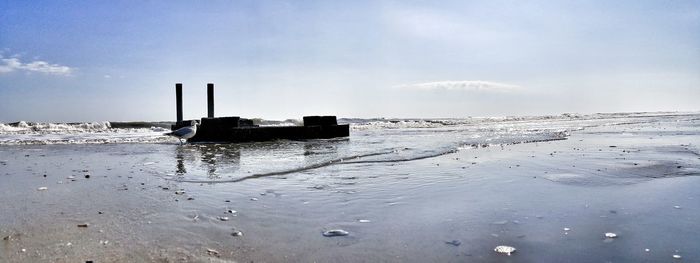 Scenic view of sea against sky during winter