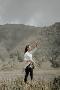 Full length of man standing on mountain