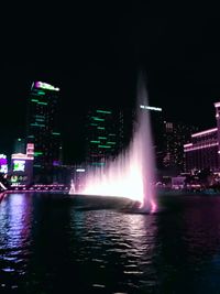 Illuminated buildings in city at night