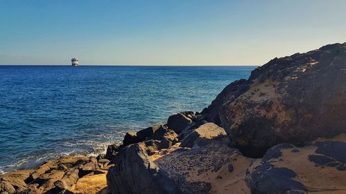 Scenic view of sea against clear sky