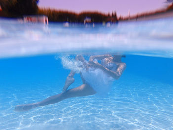 Woman swimming in pool