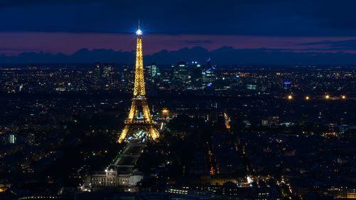 Illuminated buildings in city at night