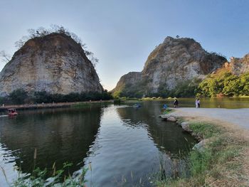 Scenic view of rock formation in lake against sky