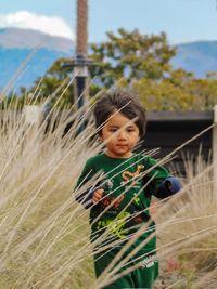 Cute boy walking on land