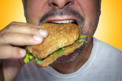 Cropped image of woman holding food