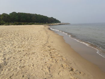 Scenic view of beach against clear sky