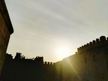 Low angle view of castle against sky during sunset