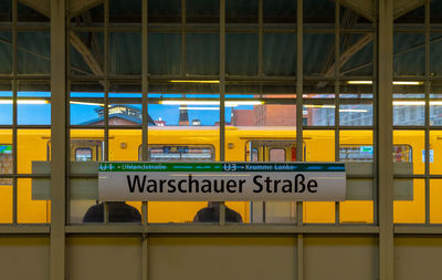 Text on glass window at subway station