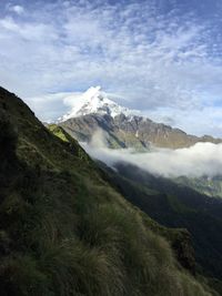 Scenic view of snowcapped mountains against sky