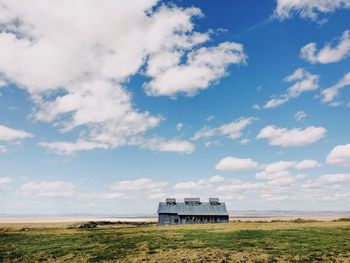 House on field against sky