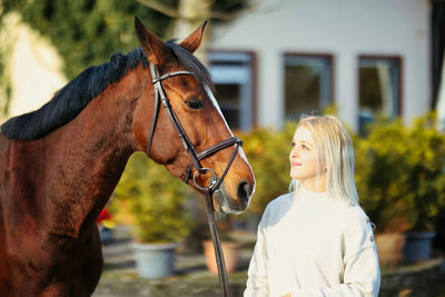 Side view of horse standing outdoors