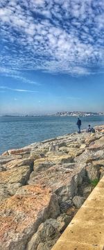 Scenic view of sea against blue sky