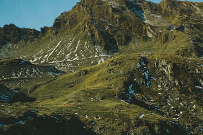 Scenic view of rocks in mountains against sky