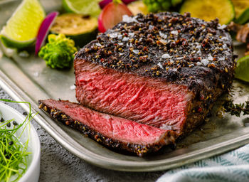 Close-up of meat on barbecue grill