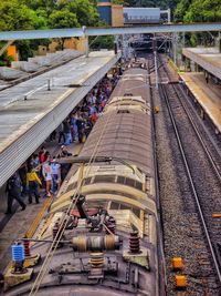 High angle view of people working on railroad track