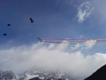 Low angle view of airplane flying in sky