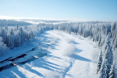 Snow covered landscape against sky