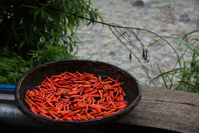High angle view of red chili peppers in container
