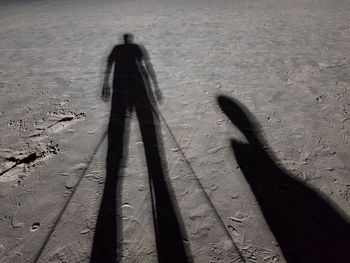 Shadow of people on sand