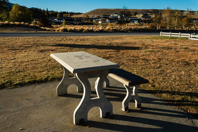 Empty bench on table in park