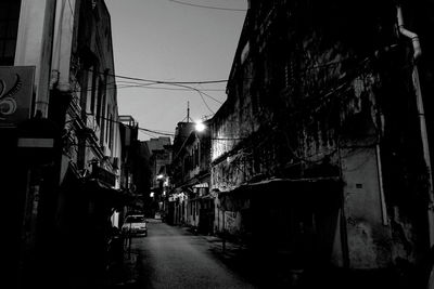Alley amidst buildings in city