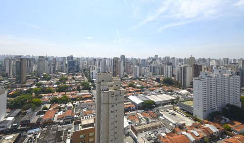 High angle view of buildings in city against sky