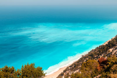 Scenic view of sea against blue sky