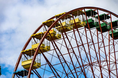 Low angle view of ferris wheel against sky