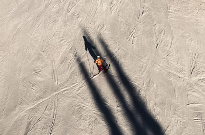 High angle view of person skiing on field