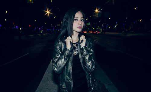 Woman standing at night