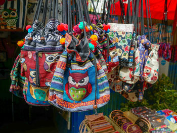 Close-up of multi colored bags for sale in market