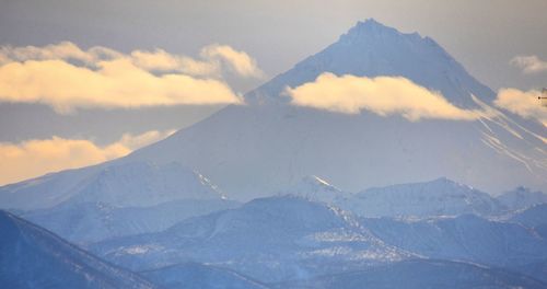 Scenic view of mountains against sky during winter