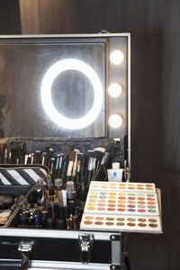 Close-up of illuminated lighting equipment on table