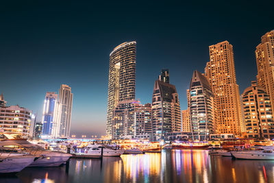 Illuminated buildings in city at night