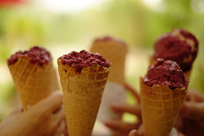 Close-up of hand holding ice cream