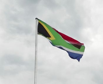 Low angle view of flag against sky