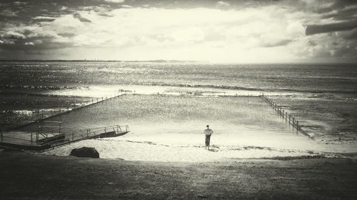 Scenic view of sea against cloudy sky