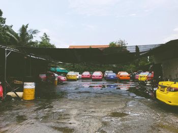 Boats in water against sky