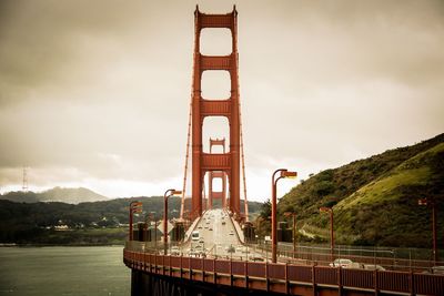 View of bridge against cloudy sky