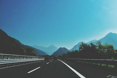 Empty country road against clear sky