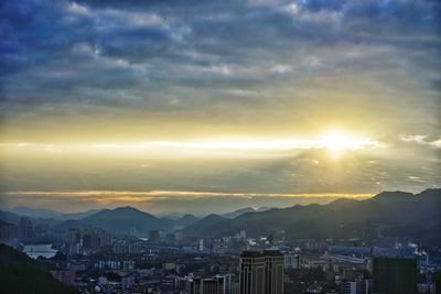 Aerial view of townscape against sky during sunset