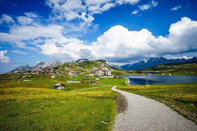 Scenic view of mountains against cloudy sky