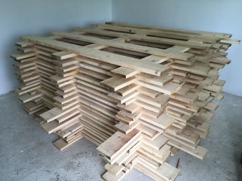 High angle view of stack of wooden table