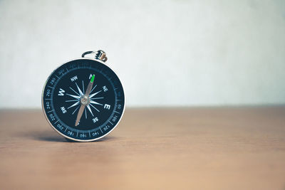 Close-up of clock on table