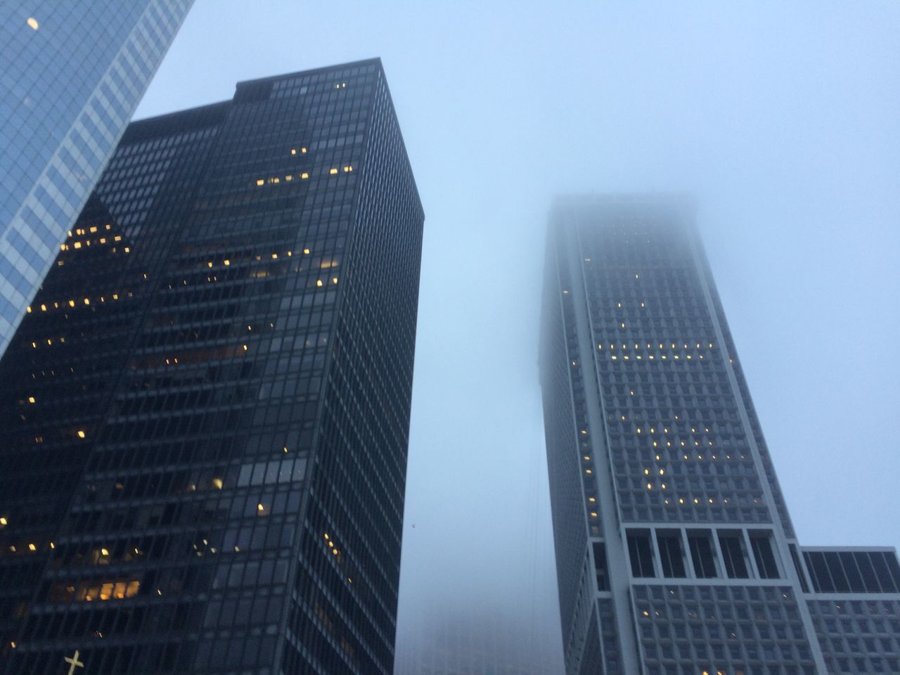 LOW ANGLE VIEW OF SKYSCRAPERS IN CITY AGAINST SKY