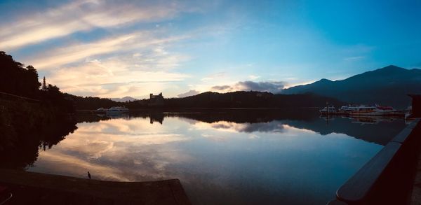 Scenic view of lake against sky during sunset