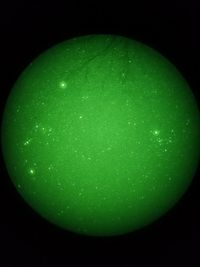 Close-up of green apple against black background