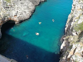 High angle view of rocks by sea