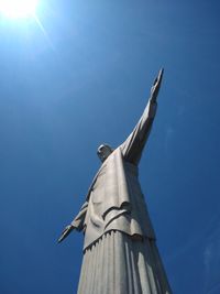 Low angle view of cross against clear blue sky