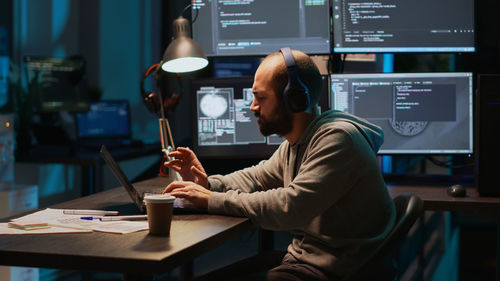 Midsection of man working in office